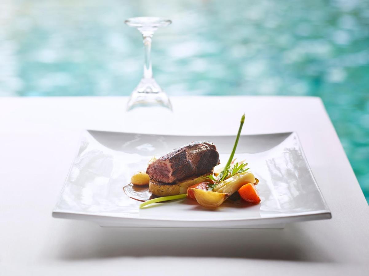 Lux* Saint Gilles Resort Exterior photo A plated meal